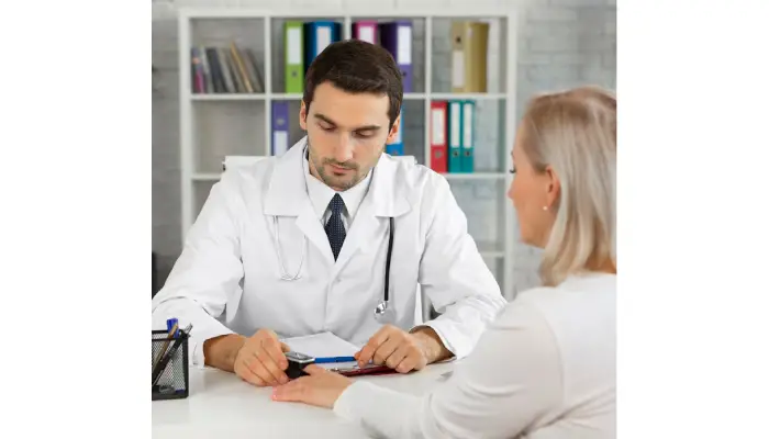Modern medical clinic interior with a doctor consulting a patient in a welcoming, professional healthcare setting