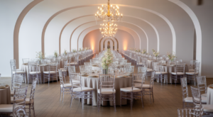 Elegant event setup with modern chairs, round tables, and sophisticated lighting, indicating a well-planned event rental service in Washington D.C.